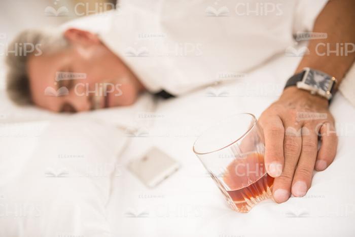 Man Sleeping After Drinking Alcohol Stock Photo