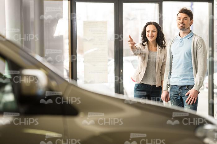 Woman Points On Vehicle Stock Photo