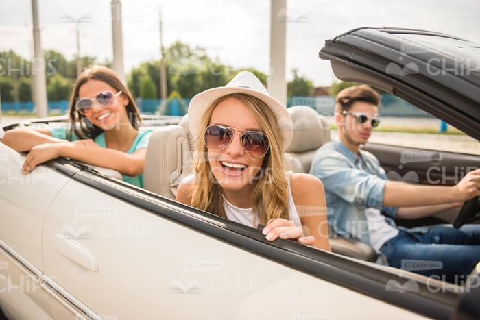 Smiling Young People Going For Drive Stock Photo