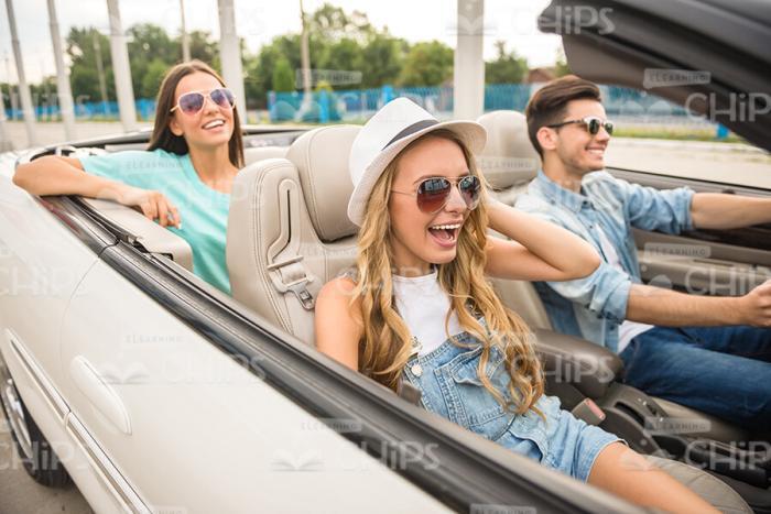 Excited Man And Women Going For Drive Stock Photo