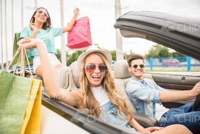 Nice Friends Driving Home After Shopping Stock Photo