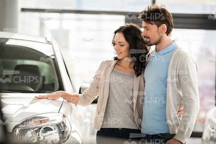 Young Lady Looking On Car And Touching It Stock Photo
