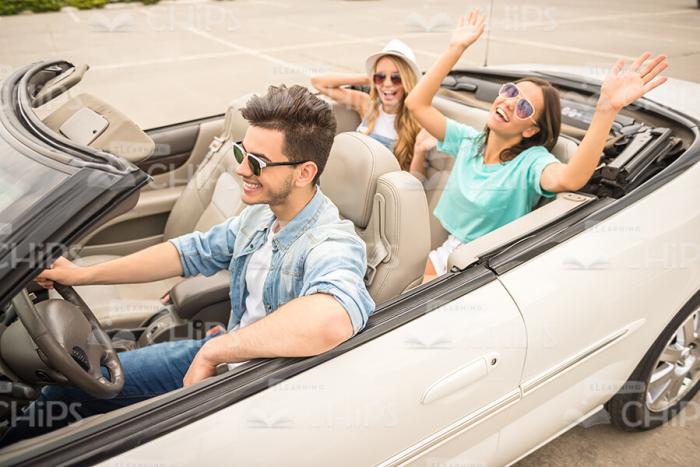 Attractive Friends Driving On Trip Stock Photo