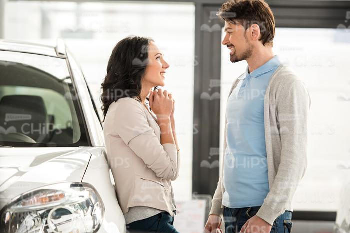 Lady Trying To Convince Her Husband To Buy New Car Stock Photo