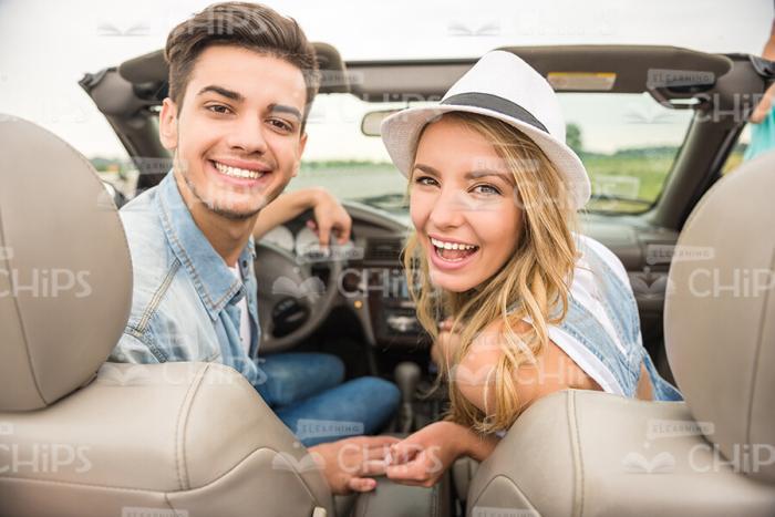 Smiling People In Cabriolet Car Stock Photo