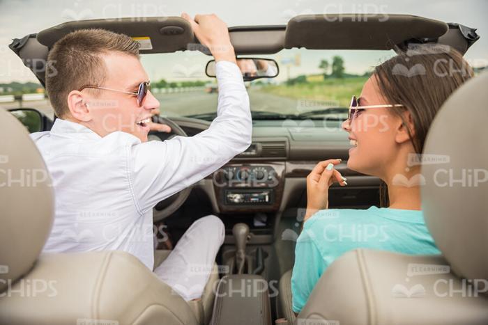 Happy Couple Driving Car Stock Photo