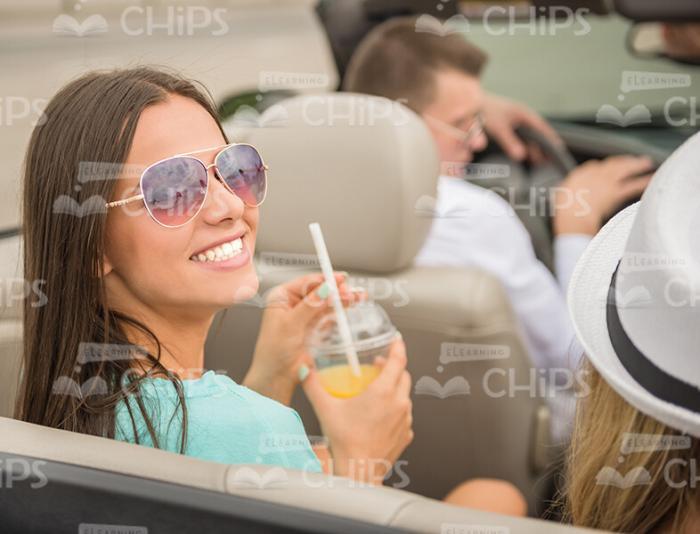 Smiling Young Woman In Cabriolet Vehicle Stock Photo