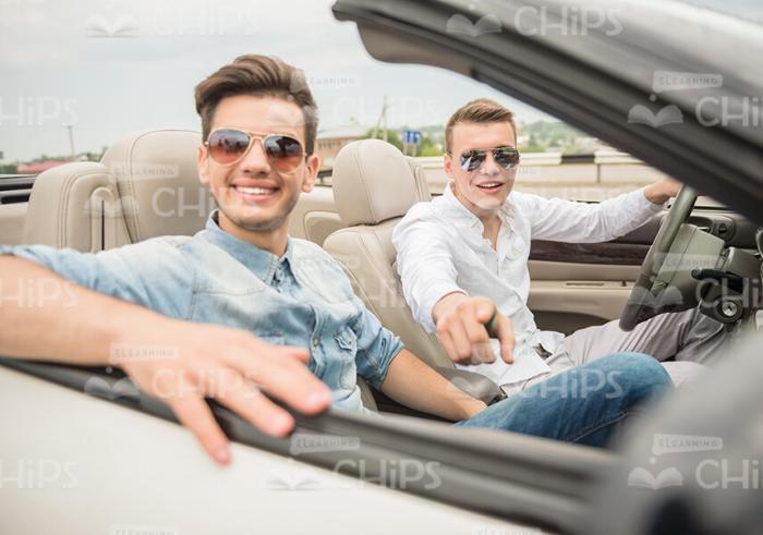 Two Glad Men In Cabriolet Car Stock Photo