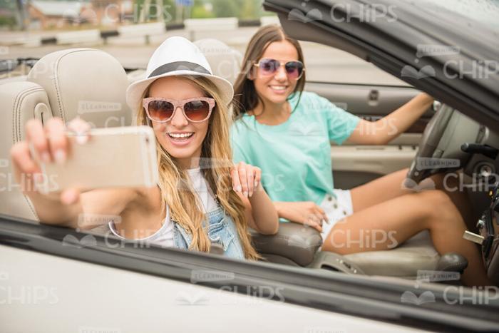Happy Girls Driving Cabriolet Stock Photo