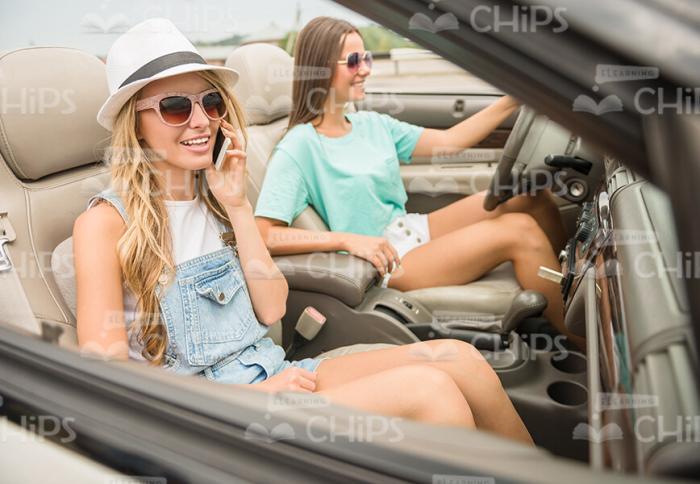 Excited Women Driving Car Stock Photo