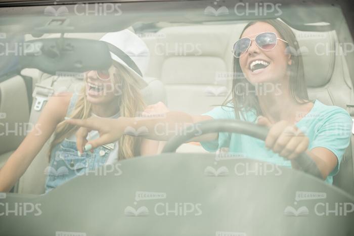 Laughing Girls Driving Car Stock Photo