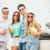 Few Friends Drinking Juice Near The White Cabriolet Stock Photo