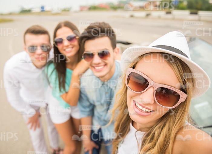 Nice Girl Makes Selfie With Her Friends Stock Photo