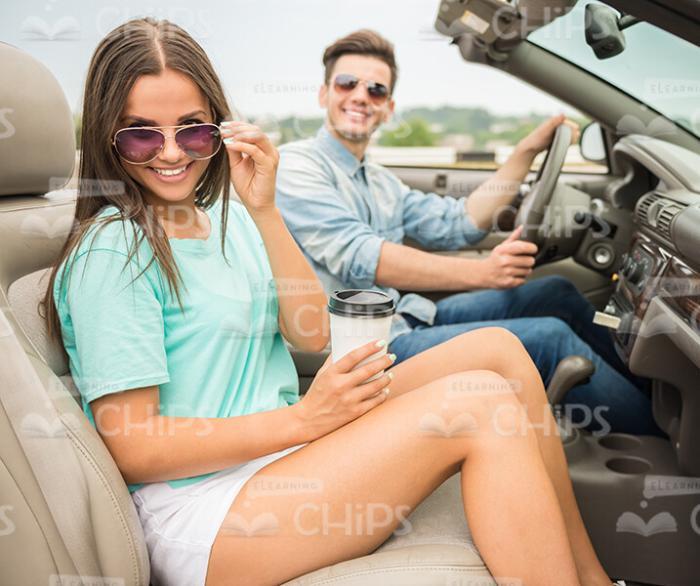 Handsome Couple Sits In Cabriolet Car Stock Photo