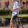 Casually Dressed Young Man Leaning On His Bicycle Stock Photo