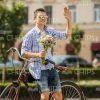 Happy Man With Bouquet Waving Hand Stock Photo