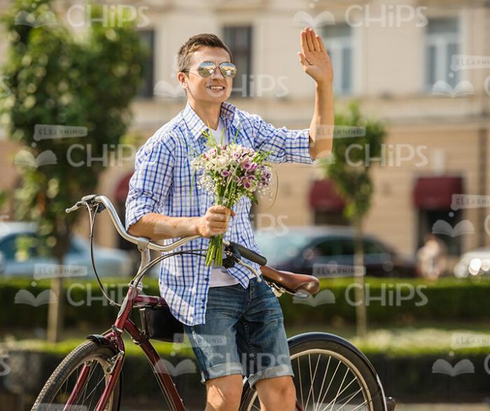 Happy Man With Bouquet Waving Hand Stock Photo