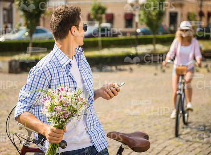 Happy Man With Bouquet Meets His Girlfriend Stock Photo