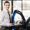 Car Dealer Opening The Vehicle Door Stock Photo
