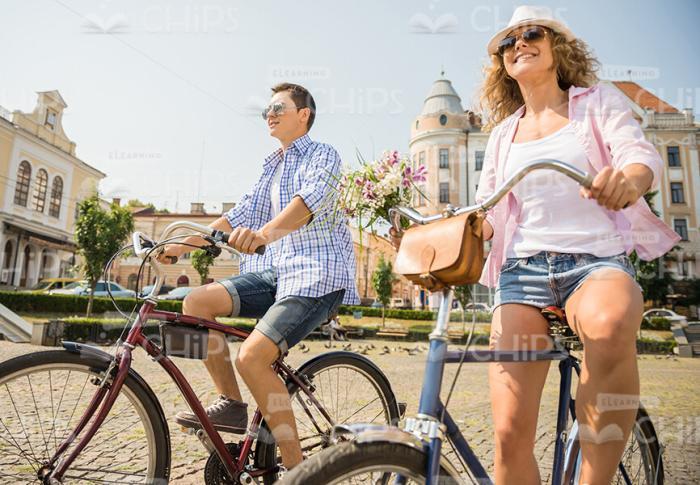 Happy Couple Riding On Bikes Stock Photo