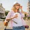 Woman Leans On Bike While Drinks Coffee Stock Photo
