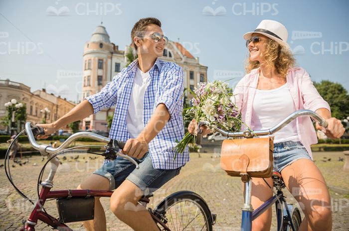 Nice Couple Rides On Bikes Together Stock Photo