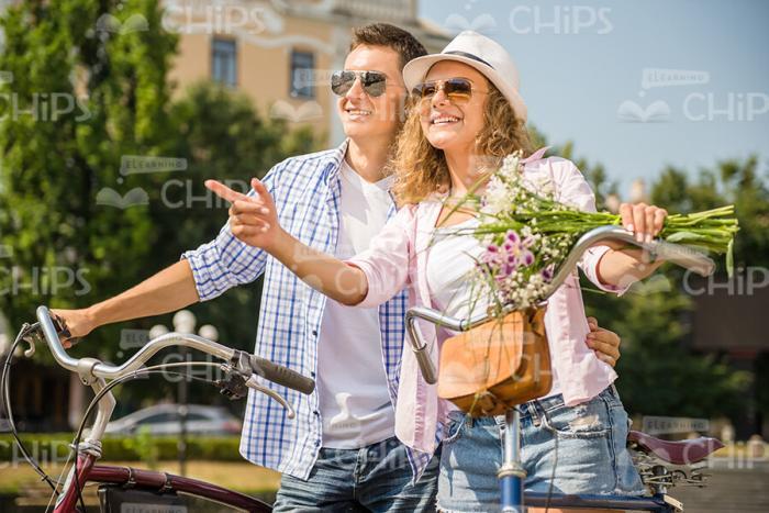 Excited Couple Looks Into The Distance Stock Photo