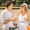 Handsome Couple Talking And Drinking Juice Stock Photo
