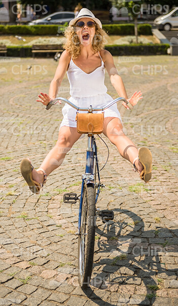 Frightened Young Girl Screaming While Cycling Stock Photo