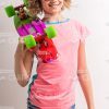 Young Girl Wearing Sunglasses And Holding Skateboard On Shoulder Stock Photo