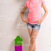 Girl With Skateboard Leaning On The Wall Stock Photo