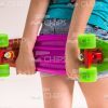 Girl's Hands Holding Skateboard Stock Photo