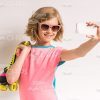 Young Girl With Roller Skates Taking Selfie Stock Photo