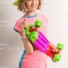 Smiling Girl Holding Skate Board Stock Photo