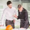 Two Engineers Discussing Project In Office Stock Photo
