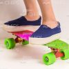 Little Girl's Legs On Skateboard Stock Photo