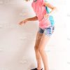 Happy Girl Balances On Skateboard Stock Photo