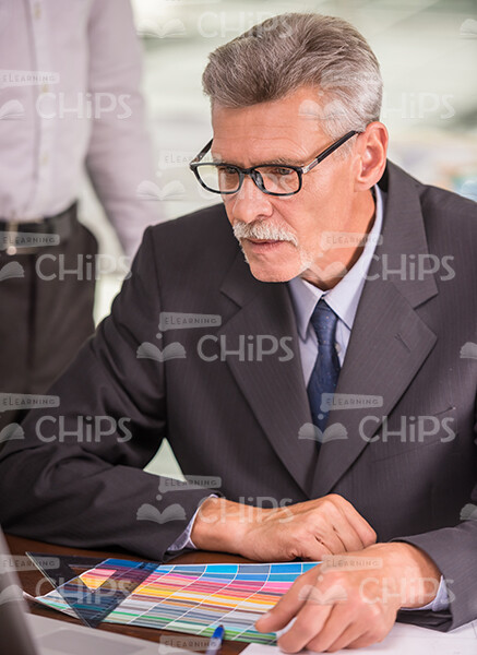 Elderly Architect Wearing Eyeglasses And Working Stock Image