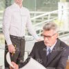 Two Construction Workers At Office Stock Photo