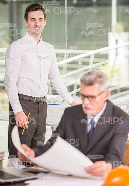 Two Construction Workers At Office Stock Photo