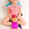 Happy Girl Listening Music In Headphones And Holding Skateboard With Orange Juice Stock Photo