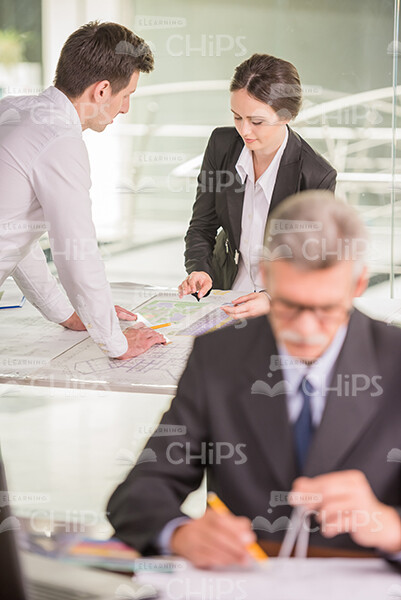 Three Engineers Engaged In Work Stock Photo