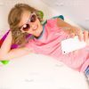 Smiling Little Girl Taking Selfie With Skateboard Stock Photo