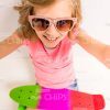 Smiling Girl With Skateboard Wearing Sunglasses and Taking Selfie Stock Photo