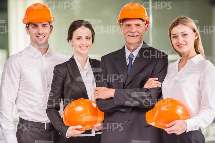 Business People With Hard Hats Stock Photo