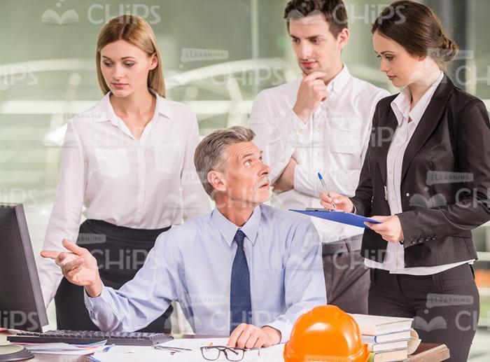 Engineers Discussing Project Stock Photo