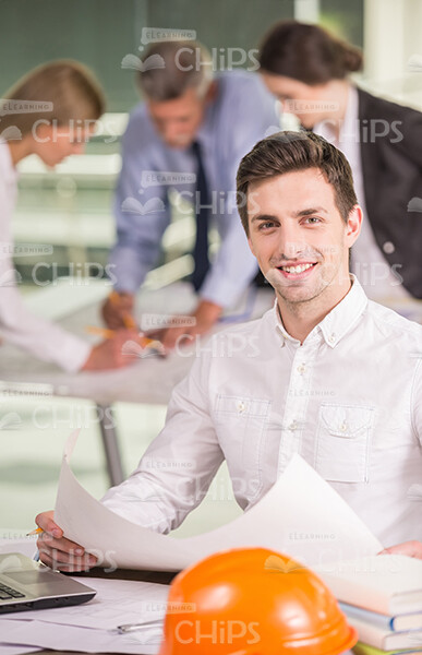 Smiling Young Man Holding Drawing Stock Photo