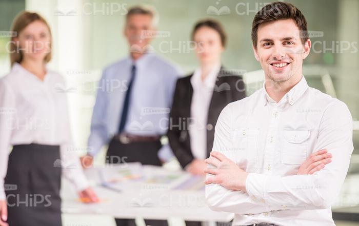 Young Businessman In Front Of His Colleagues Stock Photo