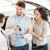 Salesman Talking With Couple Of Clients Stock Photo