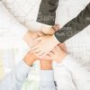 Holding Hand On Hand Gesture Stock Photo